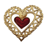 a gold heart brooch with a red heart