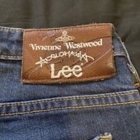 a pair of jeans with a label that says vincent westwood acoustic lee